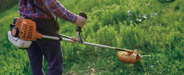 handheld brush cutter to cut grass.jpg