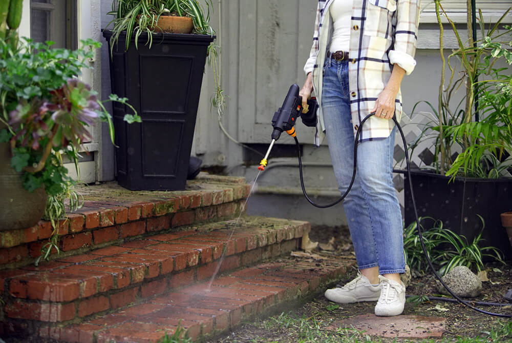 handheld-pressure-washer-to-clean-garden.jpg